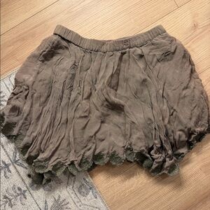 Green asymmetrical mini skirt